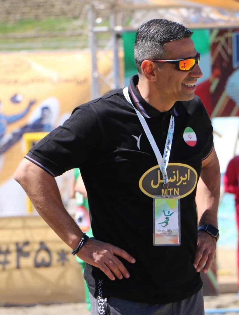 Mehdi Ghashghaei Rad courtside at a beach handball competition
