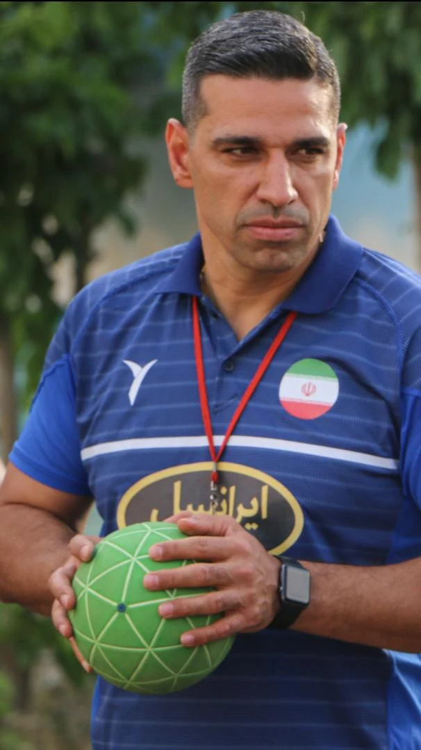 Mehdi Ghashghaei Rad holding a handball